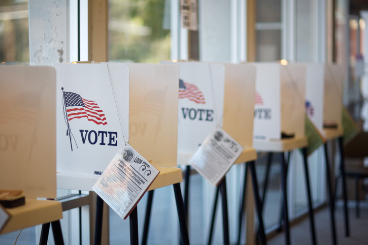 A row of voting booths marked VOTE at a Missouri polling place